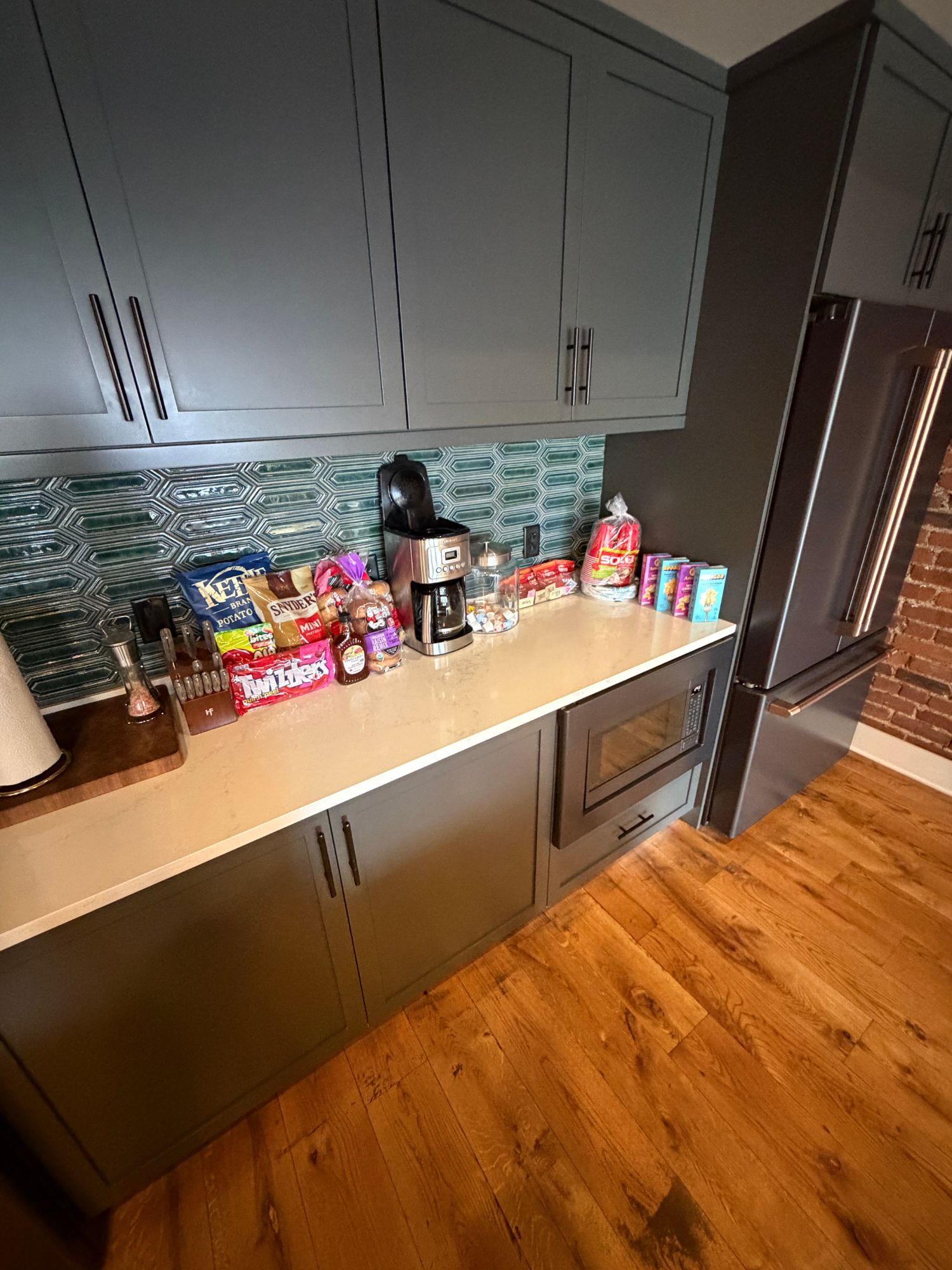 Kitchen counter with organized Rosong carts, snacks, and delivery staging