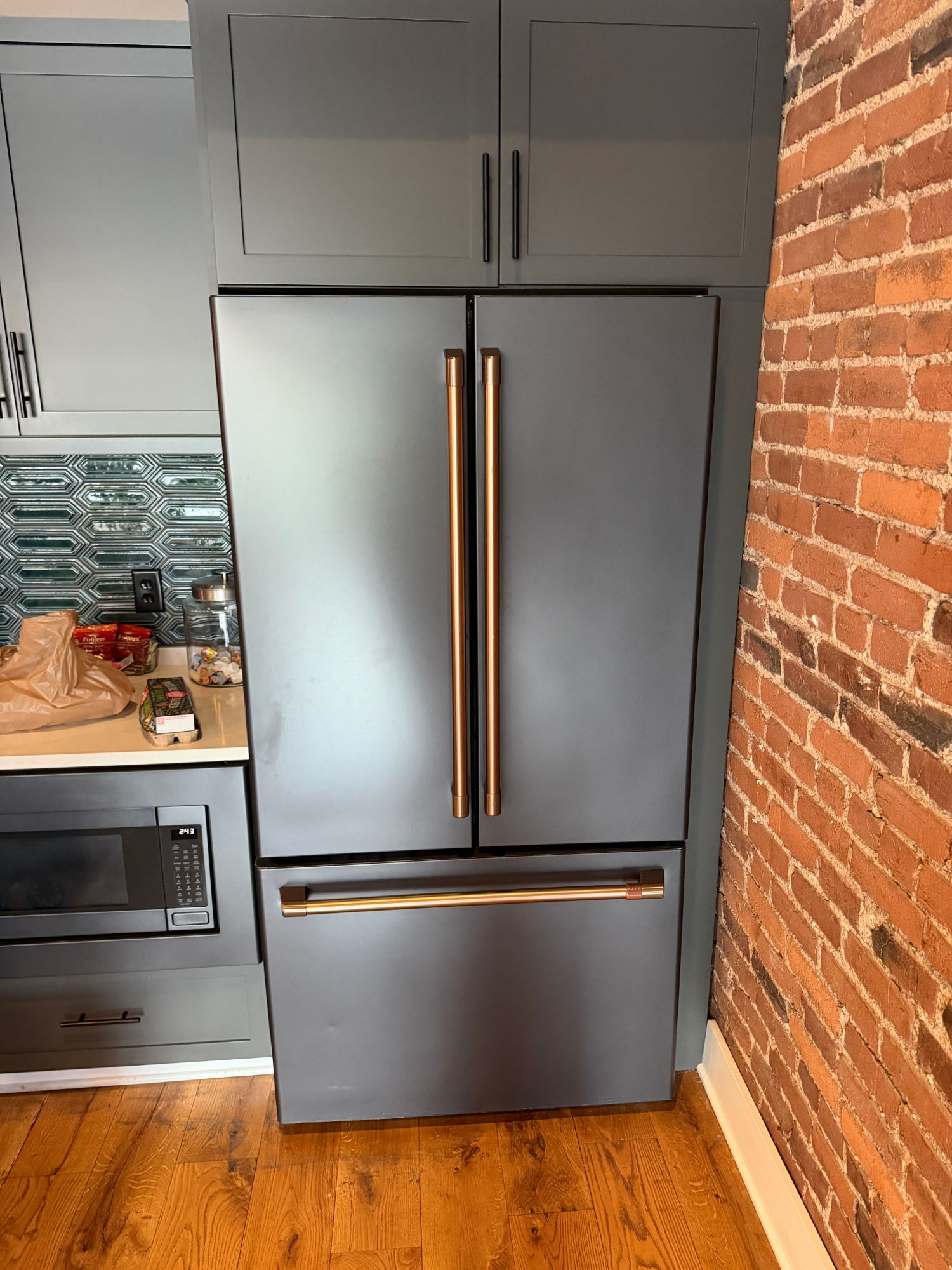 High-end refrigerator stocked with organized beverages, condiments, and prepared items